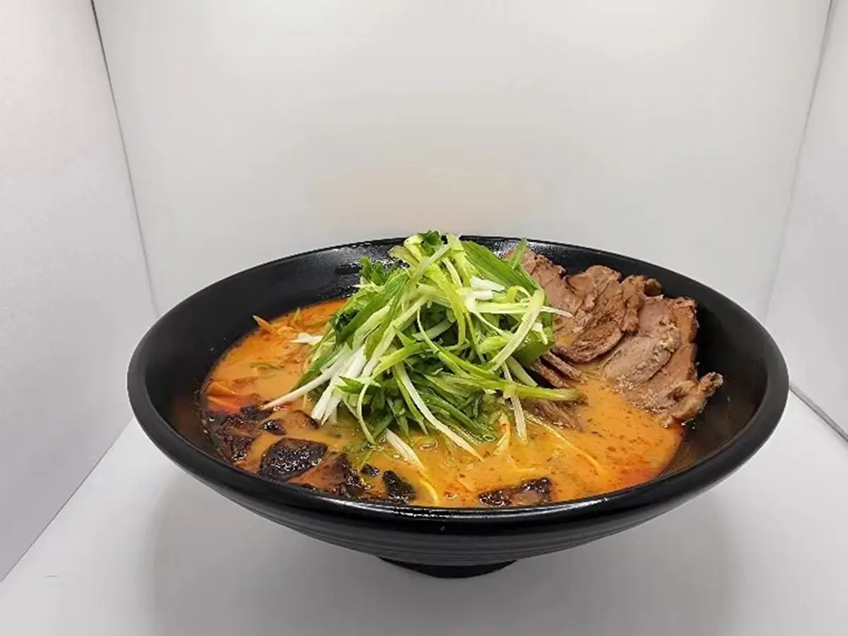 Rich spicy ramen topped with thick sliced braised chashu pork at Suisen Ramen & Sushi, a Ramen Restaurant in Oxnard