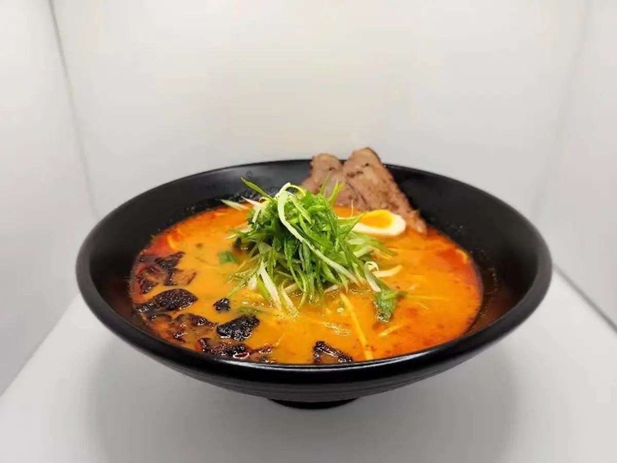 Spicy ramen with soft-boiled egg and tender chashu pork slices at Suisen Ramen & Sushi, a Ramen Restaurant in Oxnard